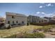 Fenced back yard with green grass, patio space, and privacy at 9855 Chatswood Trl, Highlands Ranch, CO 80126