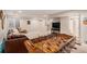 Finished basement with foosball table, adjacent to comfortable seating and bonus bathroom at 9855 Chatswood Trl, Highlands Ranch, CO 80126