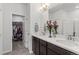 Modern bathroom with double vanity, large mirror, and walk-in shower at 15501 E 112Th Ave # 6F, Commerce City, CO 80022