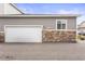 Attached single car garage with white door at 15501 E 112Th Ave # 6F, Commerce City, CO 80022