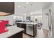Modern kitchen with island, stainless steel appliances, and ample counter space at 15501 E 112Th Ave # 6F, Commerce City, CO 80022