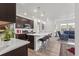 Open concept kitchen with island and stainless steel appliances at 15501 E 112Th Ave # 6F, Commerce City, CO 80022