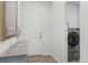 Bright laundry room with washer, dryer, and extra storage at 15501 E 112Th Ave # 6F, Commerce City, CO 80022