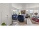 Bright and spacious living room with comfortable seating and large windows at 15501 E 112Th Ave # 6F, Commerce City, CO 80022