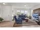 Spacious living room with comfortable seating and large windows at 15501 E 112Th Ave # 6F, Commerce City, CO 80022