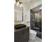 Contemporary bathroom with black vanity, walk-in shower, and geometric floor tile at 1838 Pearl # C, Boulder, CO 80302