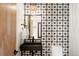 Modern powder room with black sink and patterned tile at 1838 Pearl # C, Boulder, CO 80302