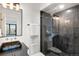 Clean bathroom with black vanity, walk-in shower, and dark tile at 1838 Pearl # C, Boulder, CO 80302