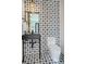 Stylish powder room with black sink and patterned tile at 1838 Pearl # C, Boulder, CO 80302