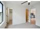 Bright bedroom with large window, ceiling fan, and access to a walk-in closet at 1838 Pearl # C, Boulder, CO 80302