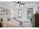 Bright bedroom with a ceiling fan and large windows at 1838 Pearl # C, Boulder, CO 80302