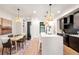 Modern kitchen with island, stainless steel appliances, and dark wood cabinetry at 1838 Pearl # C, Boulder, CO 80302