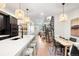 Modern open concept kitchen with island and hardwood floors at 1838 Pearl # C, Boulder, CO 80302