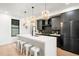 Modern kitchen with island, stainless steel appliances, and dark wood cabinetry at 1838 Pearl # C, Boulder, CO 80302