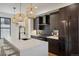 Modern kitchen features stainless steel appliances and dark wood cabinets at 1838 Pearl # C, Boulder, CO 80302