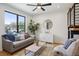 Modern living room with large windows and comfortable seating at 1838 Pearl # C, Boulder, CO 80302