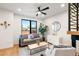 Cozy living room featuring a gray sofa and large window at 1838 Pearl # C, Boulder, CO 80302