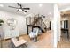Bright and airy living area with hardwood floors, modern staircase, and open floor plan at 1838 Pearl # C, Boulder, CO 80302
