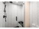 Clean, modern shower with white hexagon tile and black accents at 1838 Pearl # C, Boulder, CO 80302