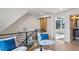Upstairs sitting area with two armchairs and a view into another room at 1838 Pearl # C, Boulder, CO 80302