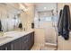 Modern bathroom with a double vanity, sleek cabinets, and a glass-enclosed shower offering a spa-like experience at 3361 Mariposa St, Denver, CO 80211