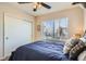 Comfortable bedroom with a ceiling fan, closet, and large window that provides ample natural light at 3361 Mariposa St, Denver, CO 80211