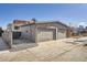 Two-car garage with driveway, offering secure parking and additional storage space at 3361 Mariposa St, Denver, CO 80211