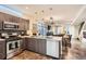Modern kitchen with stainless steel appliances and an open floorplan to the living room and dining area at 3361 Mariposa St, Denver, CO 80211