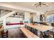 Modern living area features a large dining table and a built-in bench with storage for entertaining at 3361 Mariposa St, Denver, CO 80211