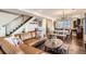 Open living room boasts a modern design, featuring a dining area and staircase to the left at 3361 Mariposa St, Denver, CO 80211