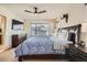 Cozy main bedroom with dark wood furnishings, a comfortable bed, and a ceiling fan for added comfort at 3361 Mariposa St, Denver, CO 80211