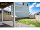 View of backyard with a playhouse, mix of grass and gravel, and a privacy fence at 4443 N Quatar Ct, Aurora, CO 80019