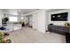 Large basement area with neutral carpeting, a TV, and ample space for recreation and relaxation at 4443 N Quatar Ct, Aurora, CO 80019