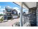 A gray two-story home featuring a brick driveway, a gray front exterior and a stone balcony at 4443 N Quatar Ct, Aurora, CO 80019