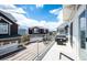 Cozy front porch with outdoor furniture, overlooking a quiet residential street with neatly maintained homes at 4443 N Quatar Ct, Aurora, CO 80019