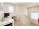 This cozy loft space includes a desk, window, and carpeted floor at 4443 N Quatar Ct, Aurora, CO 80019