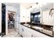 This Primary bath includes dual sinks and a walk-in closet at 4443 N Quatar Ct, Aurora, CO 80019