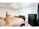 This main bedroom offers carpet floors and an entry into the Primary bath at 4443 N Quatar Ct, Aurora, CO 80019