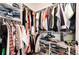This Primary walk-in closet is organized with racks and shelves at 4443 N Quatar Ct, Aurora, CO 80019