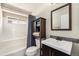 Bathroom features tiled shower and modern vanity at 9756 E 113Th Ave, Commerce City, CO 80640