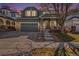 Charming two-story home with a well-manicured lawn, two car garage, and inviting front porch at 9756 E 113Th Ave, Commerce City, CO 80640