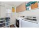 Laundry room features modern washer and dryer at 9756 E 113Th Ave, Commerce City, CO 80640