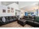 Spacious living room showcasing an open layout and hardwood flooring seamlessly connecting to other living spaces at 9756 E 113Th Ave, Commerce City, CO 80640
