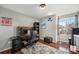 Comfortable office features hardwood floors, large window, and desk at 9756 E 113Th Ave, Commerce City, CO 80640