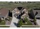 Aerial view of home with solar panels on the roof and a well-manicured yard at 8761 S Wenatchee Ct, Aurora, CO 80016
