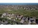 Wide aerial perspective of a residential area, featuring numerous homes in a suburban landscape at 8761 S Wenatchee Ct, Aurora, CO 80016