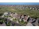Expansive aerial view of homes with lush green spaces, showcasing community and neighborhood charm at 8761 S Wenatchee Ct, Aurora, CO 80016