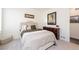 Charming bedroom features a plush bed, neutral decor, and warm, inviting ambiance at 8761 S Wenatchee Ct, Aurora, CO 80016