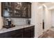 Granite countertops and stylish cabinetry provide ample space for entertaining at 8761 S Wenatchee Ct, Aurora, CO 80016
