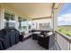 Enjoy outdoor living on this covered porch with comfortable seating and scenic neighborhood views at 8761 S Wenatchee Ct, Aurora, CO 80016